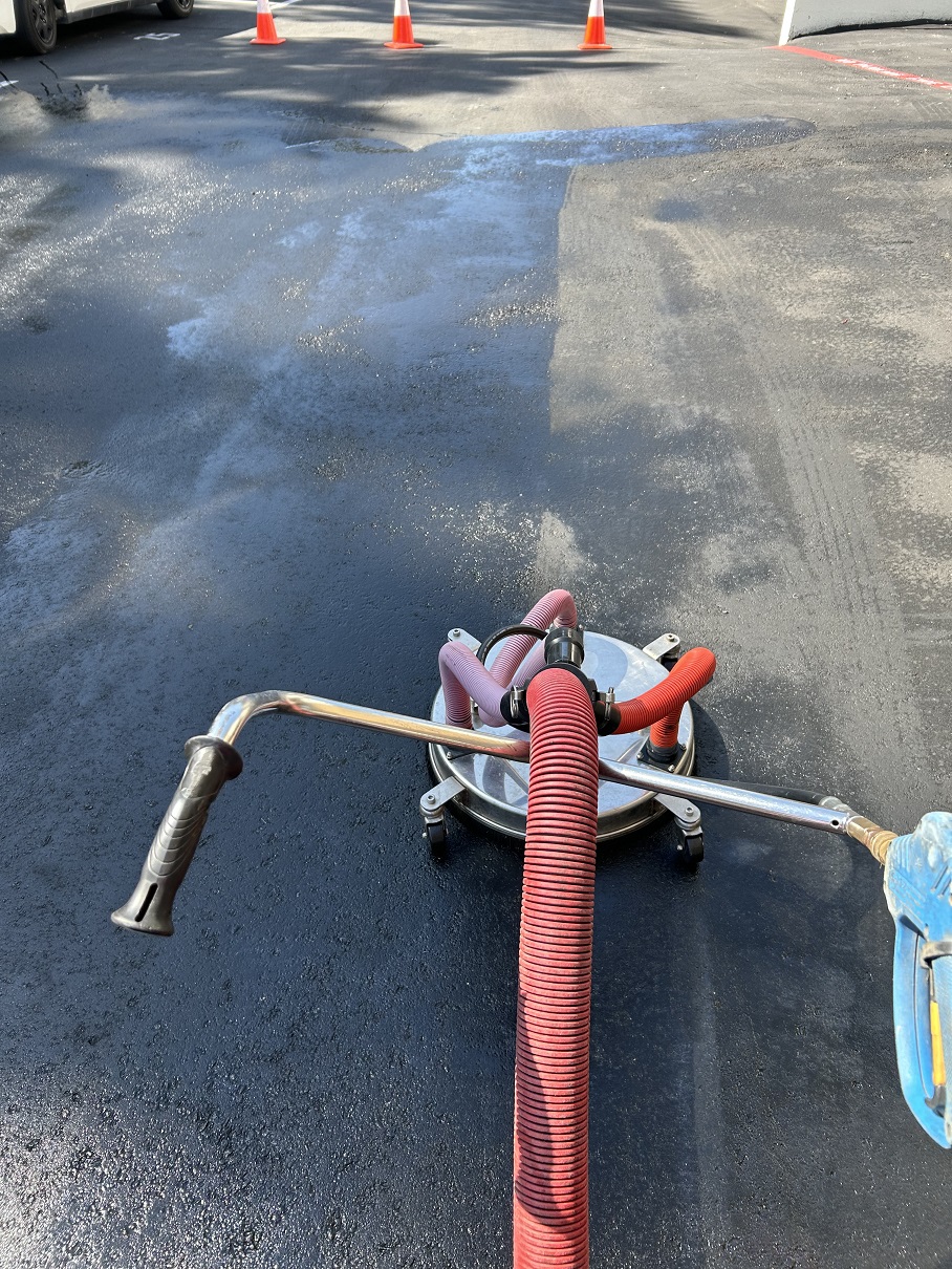 Asphalt Driveway Oil Removal by Washed Out Pressure Washing